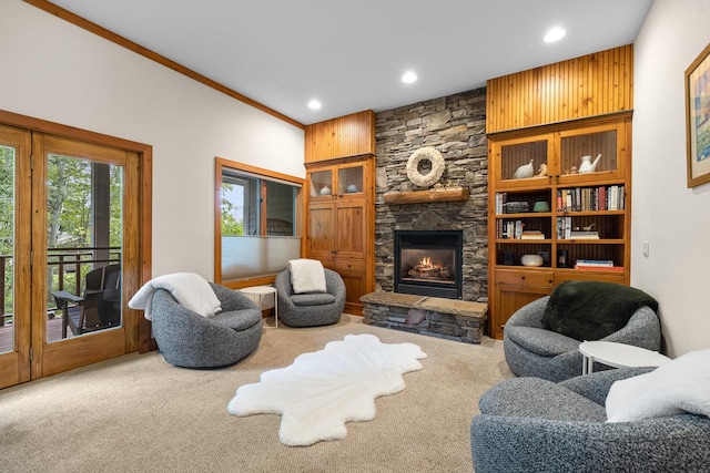 sitting room featuring a fireplace and carpet