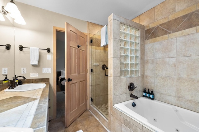 bathroom featuring tile patterned floors, separate shower and tub, and vanity