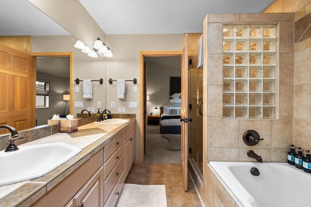 bathroom with tile patterned floors, separate shower and tub, and vanity