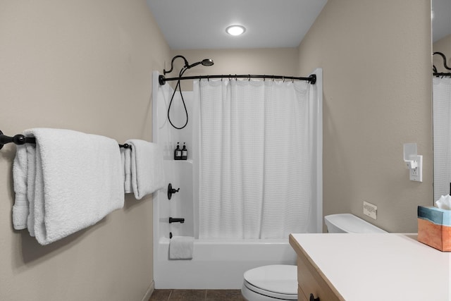 full bathroom featuring shower / tub combo with curtain, vanity, tile patterned flooring, and toilet