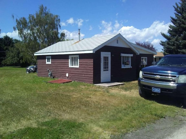 exterior space with a lawn