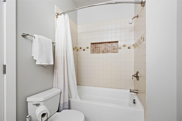 bathroom with shower / bathtub combination with curtain and toilet