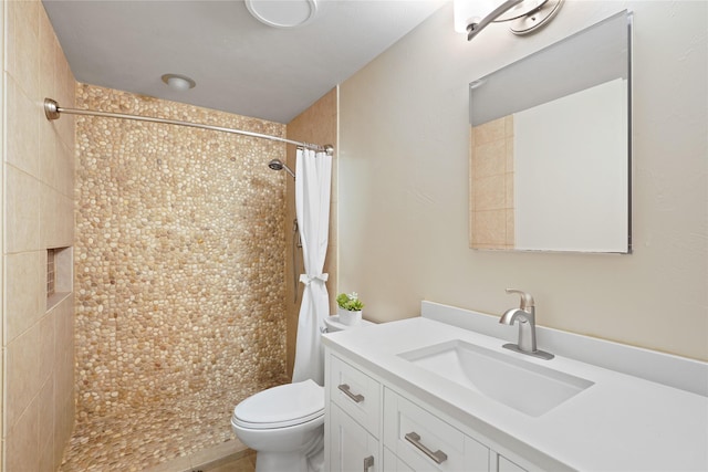 bathroom with vanity, a shower with curtain, and toilet