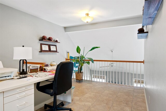 office area featuring light tile patterned floors and baseboards