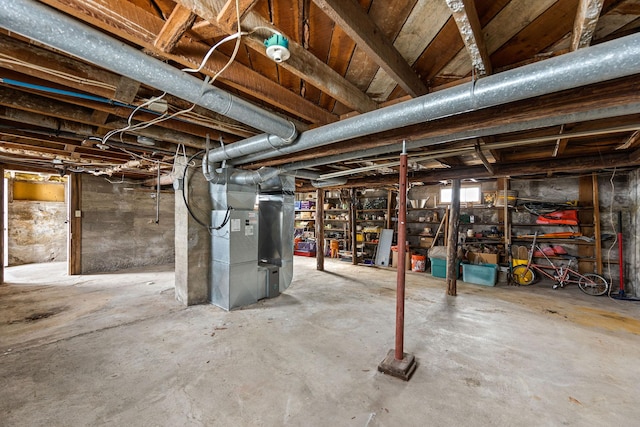 basement featuring heating unit