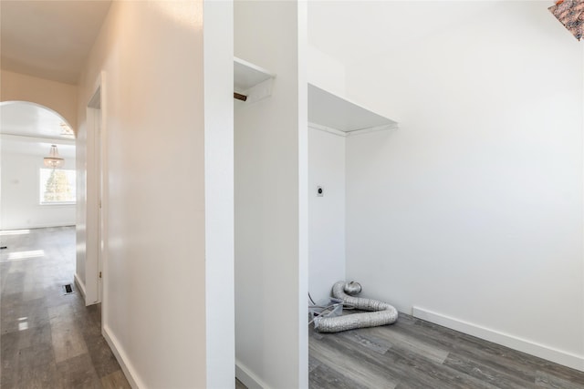 corridor with dark hardwood / wood-style floors