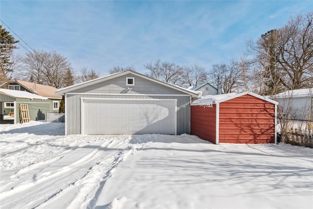 view of snow covered garage