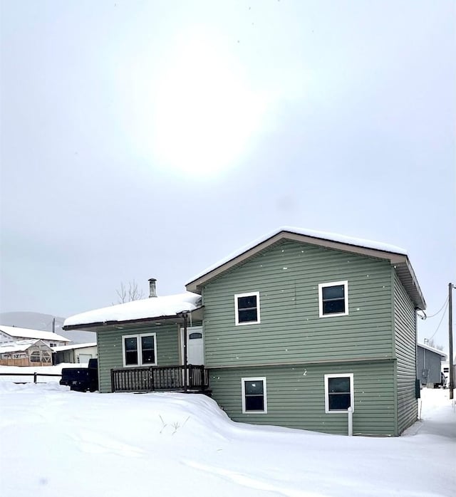 view of snow covered property