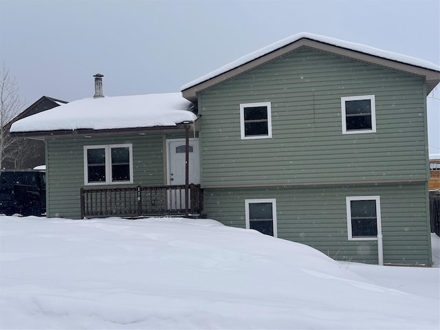 view of snow covered house