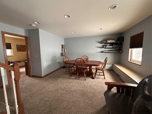 carpeted dining space featuring stairway, recessed lighting, visible vents, and baseboards