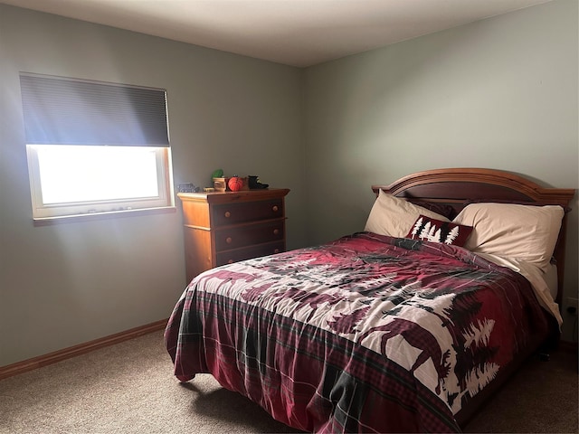 carpeted bedroom with baseboards