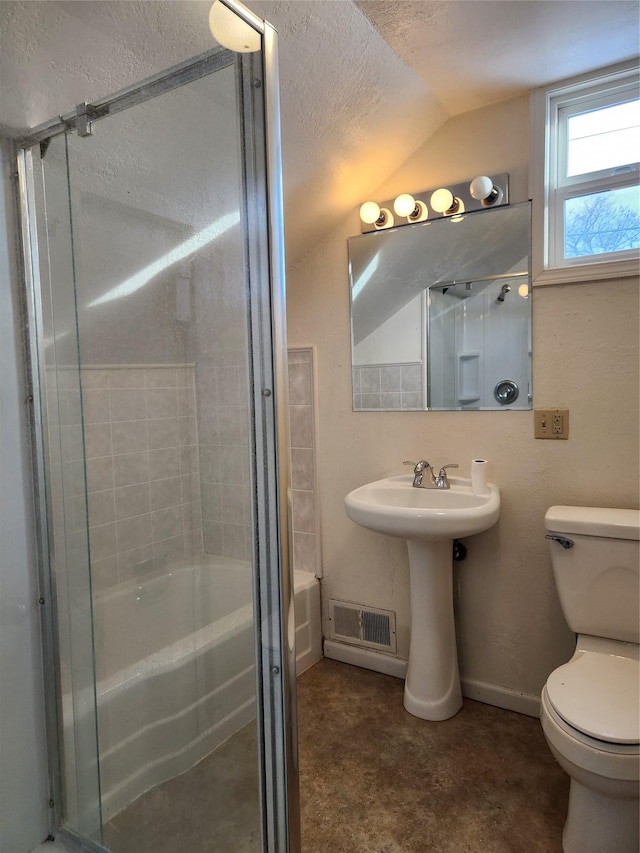 bathroom featuring lofted ceiling and toilet