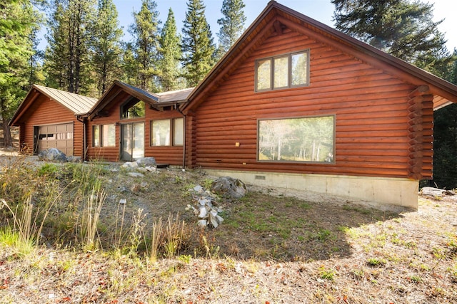 view of property exterior featuring a garage