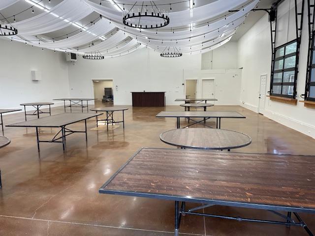 126 Soaring Eagle Dr, Whitefish, MT 59937 - game room with a towering ceiling, finished concrete floors, and a wall mounted air conditioner