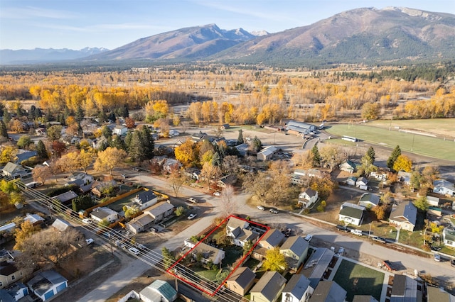 birds eye view of property featuring a mountain view