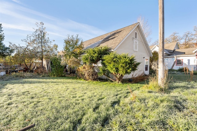 view of home's exterior featuring a yard