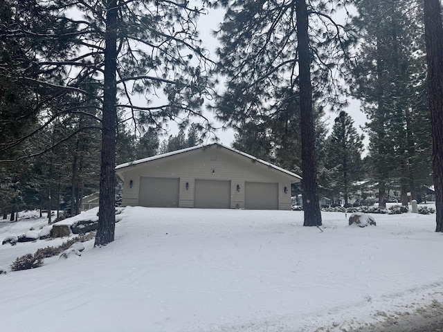 view of snow covered garage