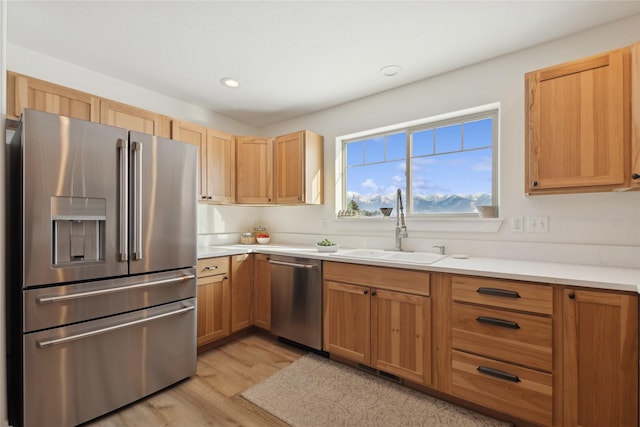 211 Mcwenneger Dr, Kalispell, MT 59901 - kitchen featuring appliances with stainless steel finishes, light wood finished floors, light countertops, and recessed lighting