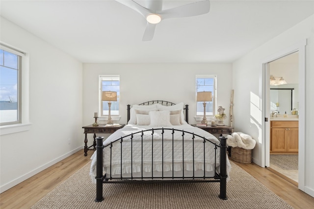 211 Mcwenneger Dr, Kalispell, MT 59901 - bedroom with light wood-style flooring, ensuite bathroom, and ceiling fan
