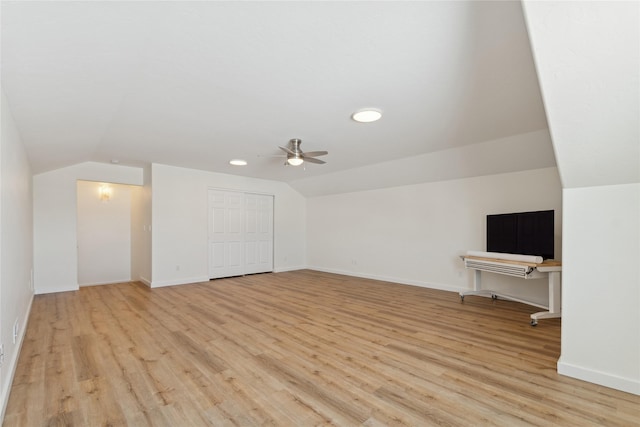 bonus room featuring lofted ceiling, ceiling fan, light wood finished floors, and baseboards