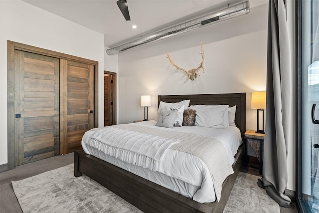 bedroom featuring ceiling fan and carpet