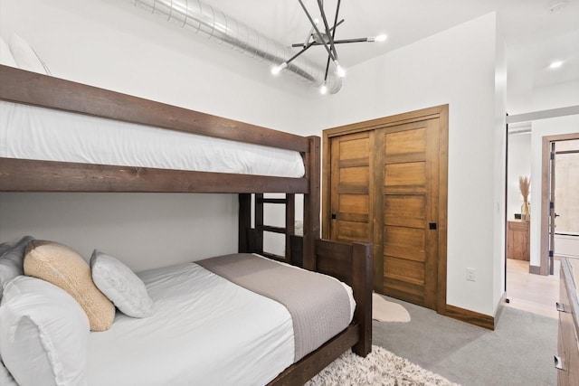 bedroom featuring light colored carpet