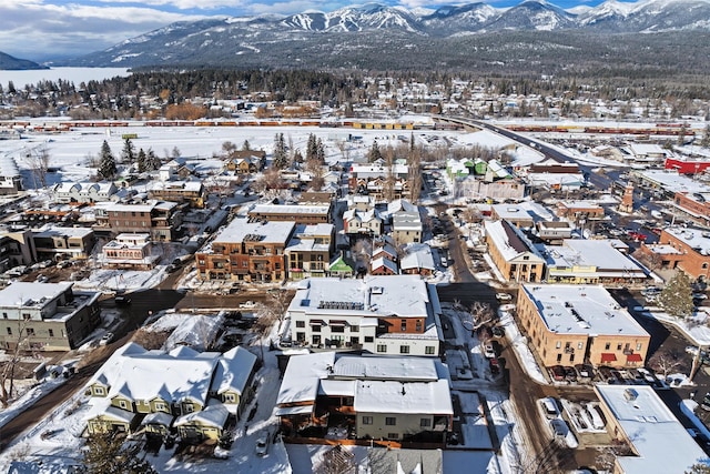 snowy aerial view featuring a mountain view