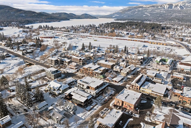 snowy aerial view featuring a mountain view