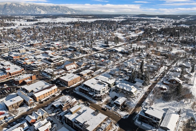 snowy aerial view with a mountain view