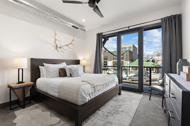 carpeted bedroom featuring ceiling fan and access to outside