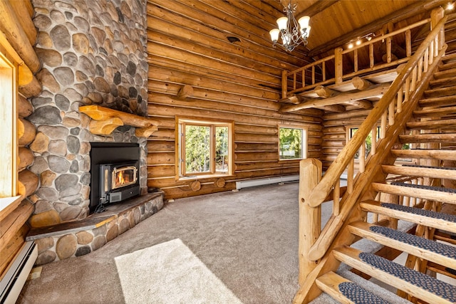 21 Barnes Ln, Noxon, MT 59853 - living room with high vaulted ceiling, a baseboard heating unit, wood ceiling, and carpet