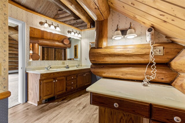 21 Barnes Ln, Noxon, MT 59853 - bathroom with rustic walls, vanity, and wood-type flooring