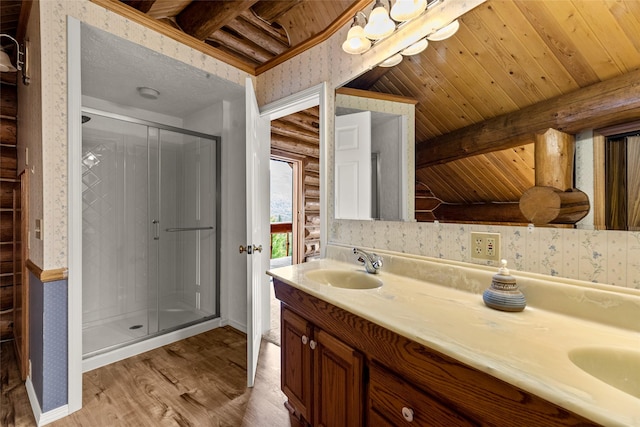 21 Barnes Ln, Noxon, MT 59853 - bathroom with vanity, hardwood / wood-style floors, walk in shower, and rustic walls