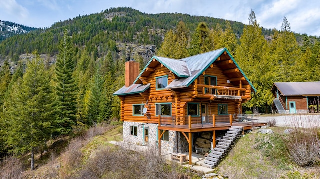 21 Barnes Ln, Noxon, MT 59853 - back of house with a deck with mountain view