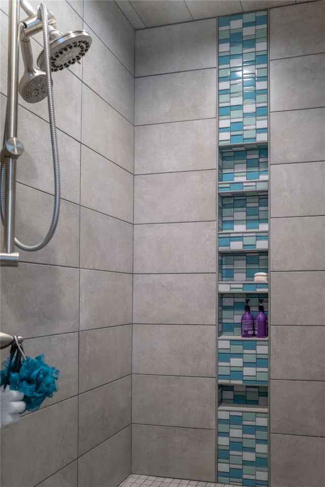 full bath featuring tiled shower