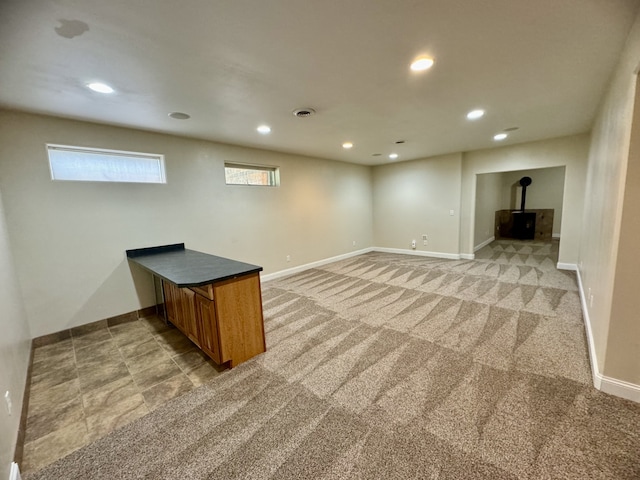 interior space featuring light colored carpet, recessed lighting, and baseboards