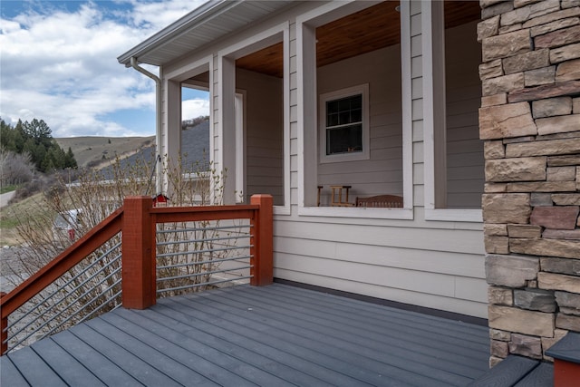 wooden terrace featuring a mountain view