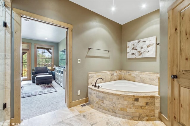 290 Wilderness Club Dr, Eureka, MT 59917 - bathroom featuring a garden tub and baseboards