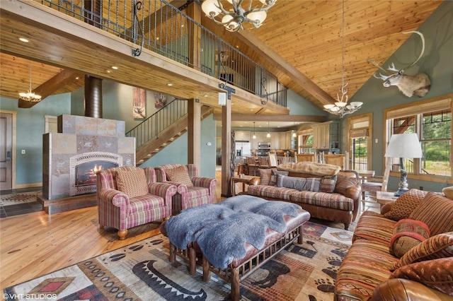 290 Wilderness Club Dr, Eureka, MT 59917 - living area with wood finished floors, wood ceiling, a towering ceiling, and an inviting chandelier