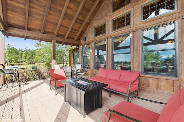 290 Wilderness Club Dr, Eureka, MT 59917 - deck featuring outdoor dining space and an outdoor living space with a fire pit