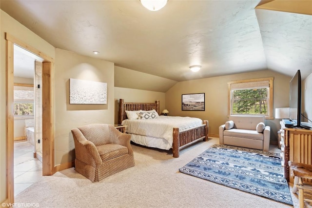 290 Wilderness Club Dr, Eureka, MT 59917 - bedroom featuring lofted ceiling, light carpet, and baseboards