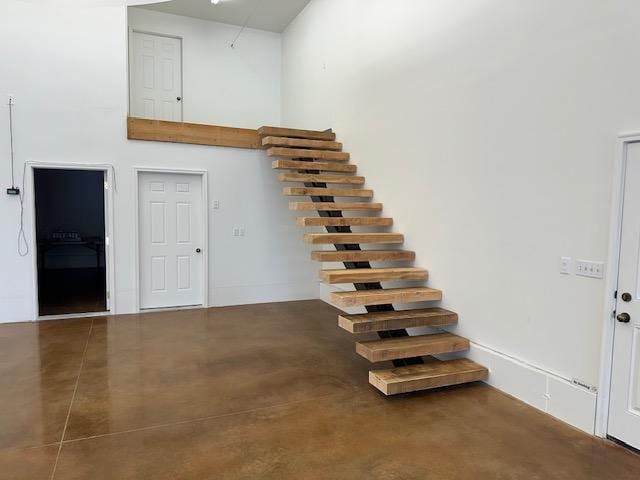 stairs with finished concrete floors