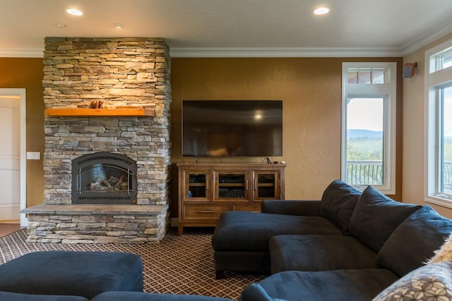 carpeted living area featuring a textured wall, a fireplace, and crown molding