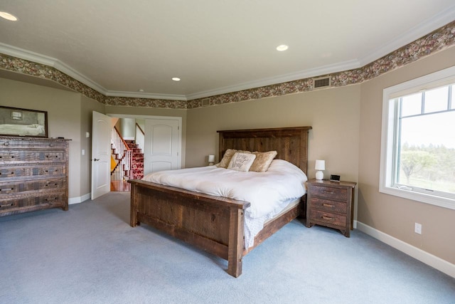 bedroom with ornamental molding, visible vents, and baseboards