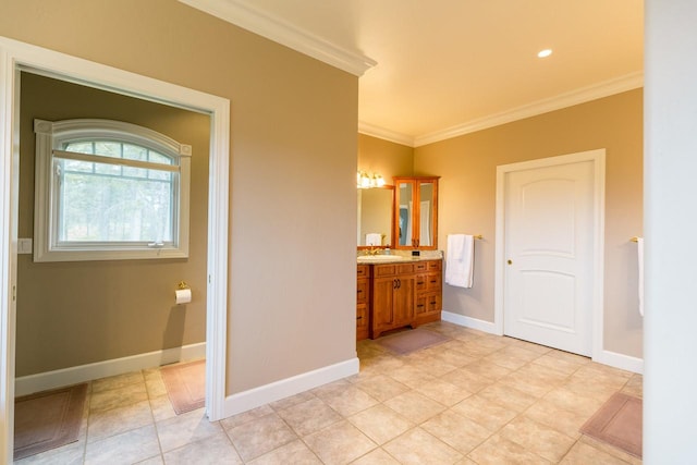 bathroom featuring recessed lighting, ornamental molding, vanity, baseboards, and tile patterned floors