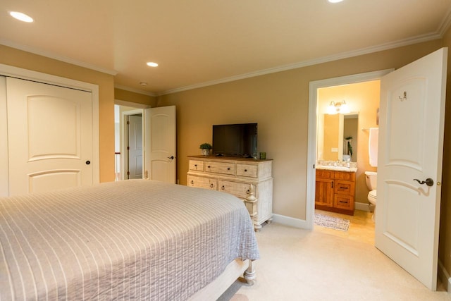 bedroom featuring baseboards, light colored carpet, ornamental molding, ensuite bathroom, and recessed lighting