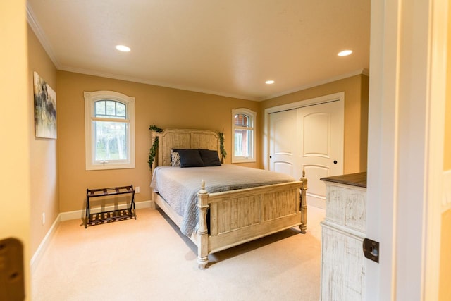 carpeted bedroom featuring ornamental molding, a closet, recessed lighting, and baseboards