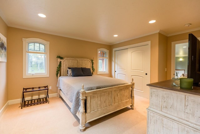 bedroom featuring ornamental molding, light carpet, and baseboards