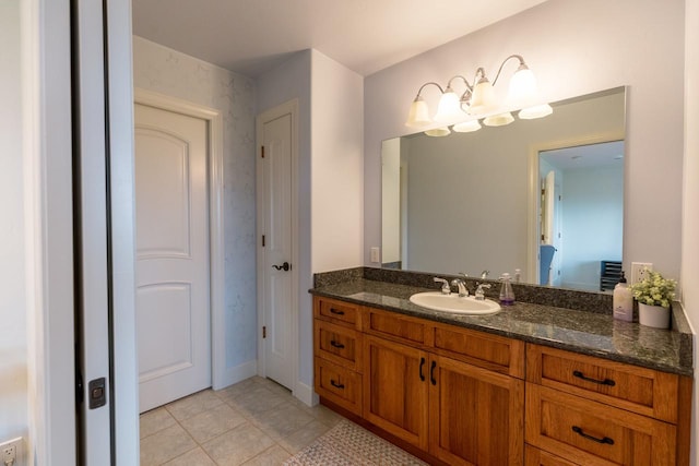 bathroom featuring tile patterned flooring and vanity