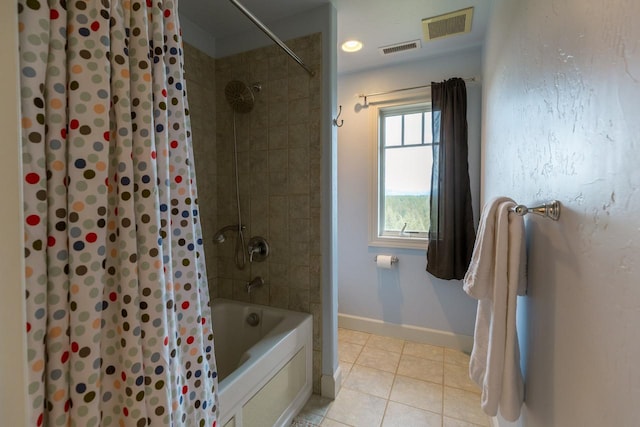 bathroom featuring shower / bath combo, visible vents, baseboards, and tile patterned floors